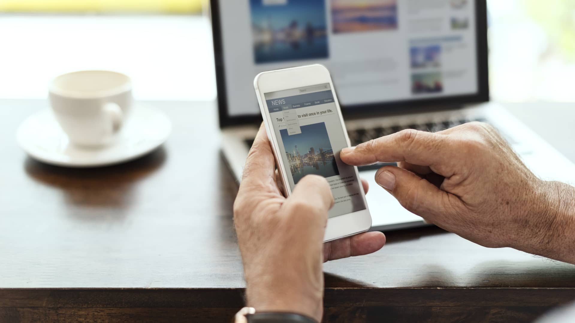 Elderly man is using mobile phone (1) (1) (1)